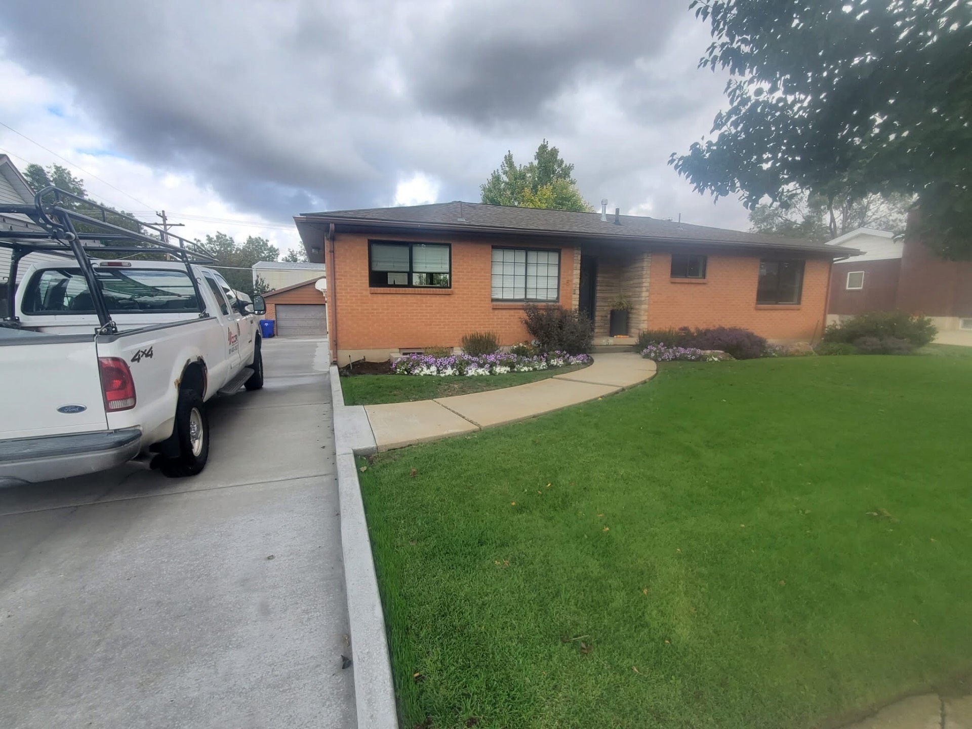 Brick ranch home with new roof and CCR truck